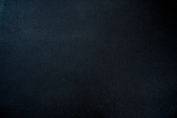 Closeup view of the black wall. Abstract pattern of a concrete wall