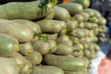 Freshly Harvested Vegetables Stacked at Local Market Stall