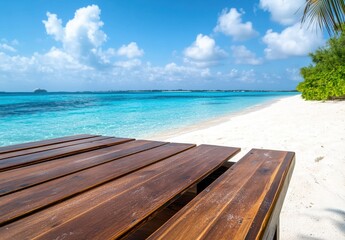 Naklejka premium Tranquil Tropical Beach with Wooden Table Overlooking Crystal Clear Water and White Sandy Shore Under a Bright Blue Sky with Fluffy Clouds