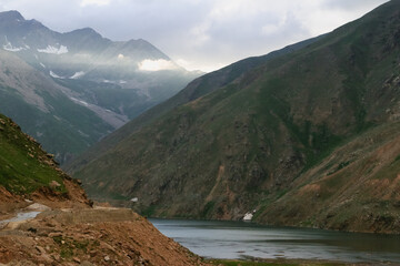 Illuminated Valley with a Calm Lake