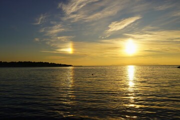 A double sunset from the shore of Glyfada, Greece