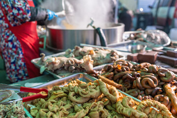 Fototapeta premium Vibrant Street Food Stall Featuring Delicious Fried Delicacies