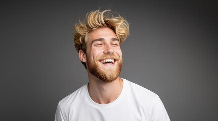 Obraz premium Positive and joyful Man laughing. Happy smiling young beauty man laughing. Portrait Of Young Handsome Man Smiling. Closeup face of smiling casual man. Happy male model.