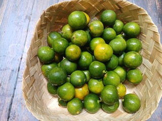 Fresh citrus on wooden background