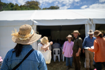 group of farmers at a field day learning about farm community  wearing a hat being sun smart....