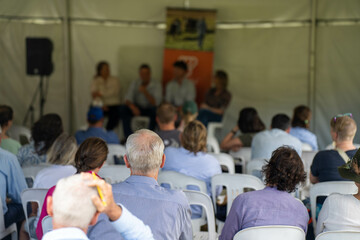 group of farmers at a field day learning about farm community  wearing a hat being sun smart....