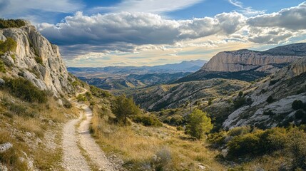 Obraz premium Remote Mountain Pass with Dramatic Sky and Scenic Landscape View
