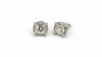 A pair of silver stud earrings with small diamond accents, isolated on white