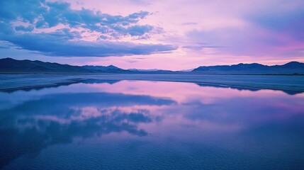 Fototapeta premium Serene Desert Landscape at Dusk with Soft Pink Skies and Reflections