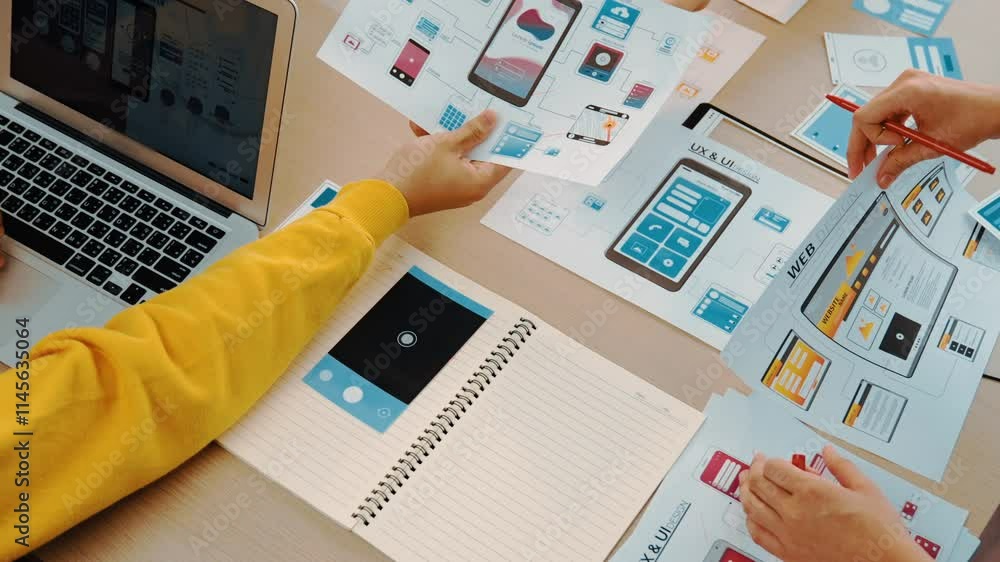Poster panorama video of startup company employee planning on user interface prototype for mobile applicati