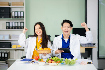 Doctors sharing fresh vegetables, promoting health and nutrition. Ideal for wellness, healthcare, and science themes.