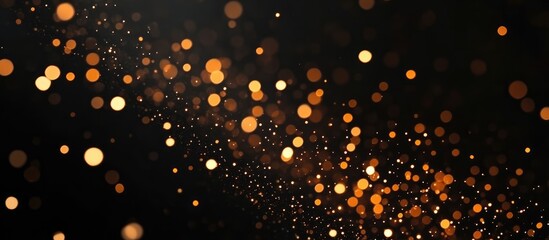 Naklejka premium Golden light bokeh effect creating a shimmering background for festive or celebratory themes on a dark isolated backdrop
