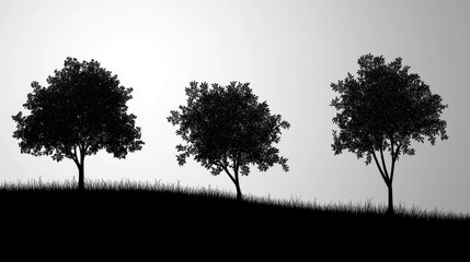 Silhouette of trees on a hillside with grass against a serene countryside background in monochrome tones