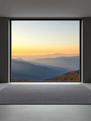 Mountain landscape view at sunset from a modern interior space with large window framing