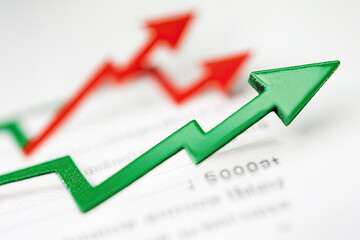 Abstract line graph with red and green arrows, symbolizing stock market fluctuations