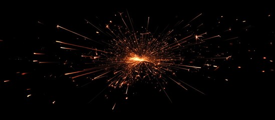 Fototapeta premium Dynamic explosion of colorful fireworks and sparklers illuminating a dark background with radiant sparks and vibrant light trails.