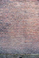 Naklejka premium Closeup view of the red wall. Abstract pattern of a brick wall