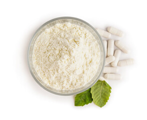 Glass with collagen powder, pills and leaves on white background