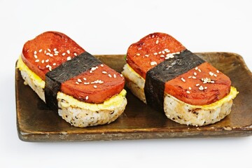 Classic Hawaiian spam musubi, made with grilled spam, seasoned rice, and wrapped with nori seaweed....