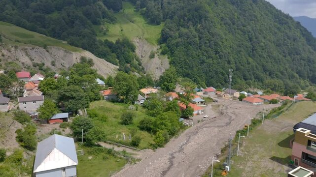 Aerial landscape view of rural houses and green mountains in Gebele City in Azerbaijan