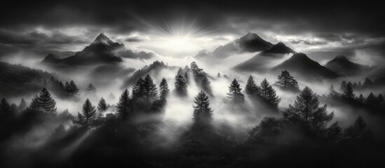 Misty morning landscape with dramatic light and mountains surrounded by atmospheric fog highlighting nature's beauty and serenity