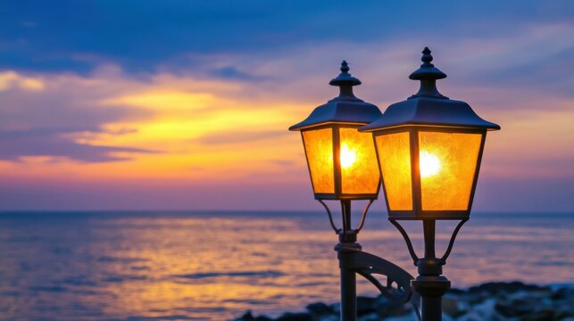 Public classic lights lamp at beach side with landscape view of sunset sky at behinds