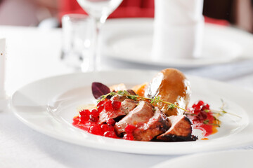 roasted duck with pear on Christmas table