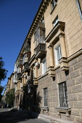 Architecture of old Soviet Union houses in Stalin's Empire style. Exterior of the facade of a vintage residential building in Russia