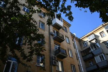 Obraz premium Architecture of old Soviet Union houses in Stalin's Empire style. Exterior of the facade of a vintage residential building in Russia