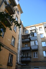 Architecture of old Soviet Union houses in Stalin's Empire style. Exterior of the facade of a vintage residential building in Russia