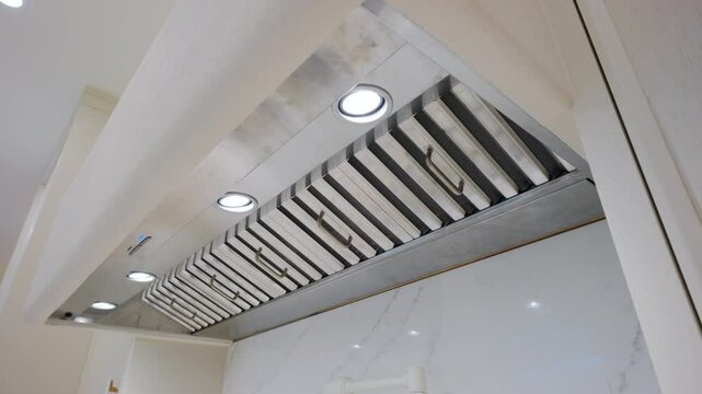 Big clean modern kitchen at the restaurant or cafe. Ventilation for the kitchen. Move camera