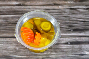 Arabian pickles, marinated preserved pickled vegetables of chili peppers, cucumber, potato cubes, olives, carrot, Arabic traditional Syrian appetizers as a side dish with a main course