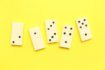 White dominos blocks on yellow background