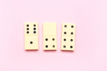 White dominos blocks on pink background