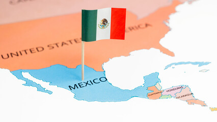 A map of Mexico with the national flag of Mexico on it. The flag is a Vertically striped green-white-red national flag with a central coat of arms