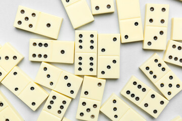 Many white dominos blocks on grey background