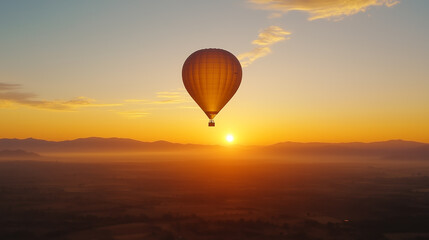 Fototapeta premium Hot air balloon soaring above mountains at sunrise, showcasing vibrant colors and panoramic views of the landscape