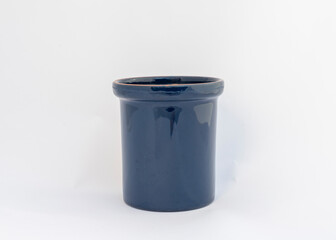 Blue ceramic cache pot on white background with copy space.