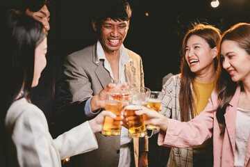 A cheerful group of friends enjoying wine and food on a sunny patio. Toasting with wineglasses, they celebrate togetherness in a scenic outdoor setting, blending fun, friendship, and a festive mood.