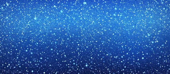 Obraz premium Vibrant blue glitter background with shimmering particles creating a festive and eye-catching atmosphere for design projects.