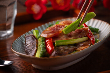 Delicious spicy homemade stir-fried Chinese smoked sausage with asparagus.