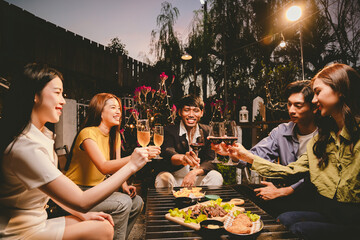 A lively group of friends enjoying beers at a festive pub, toasting with frosty pints. The scene captures the joy of friendship, culture, and celebration over drinks and appetizers on a sunny terrace.