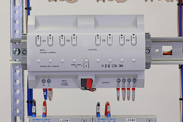 Automation modules controlled via a digital data bus. It is installed in an electric switchboard. Soft focus.