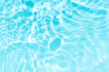 Blue water with ripples on the surface. Defocus blurred transparent blue colored clear calm water...