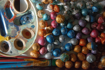 close up of colorful acorns on a white background