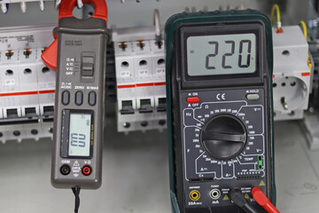 Fototapeta premium A digital multimeter for measuring the parameters of electrical circuits. Close-up. Soft focus.