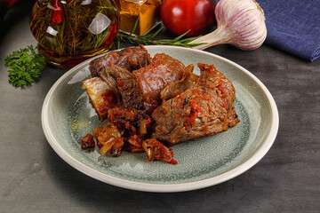 Baked beef ribs with vegetables