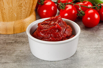Red tomato paste in the bowl