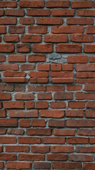 Obraz premium Close-up view of a textured red brick wall.