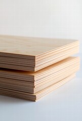 This close-up image features elegantly stacked plywood boards, showcasing their distinct layers and smooth finish, emphasizing the quality and craftsmanship in woodworking.
